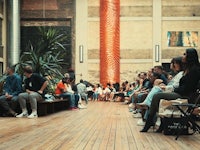 a crowd of people watching a fashion show